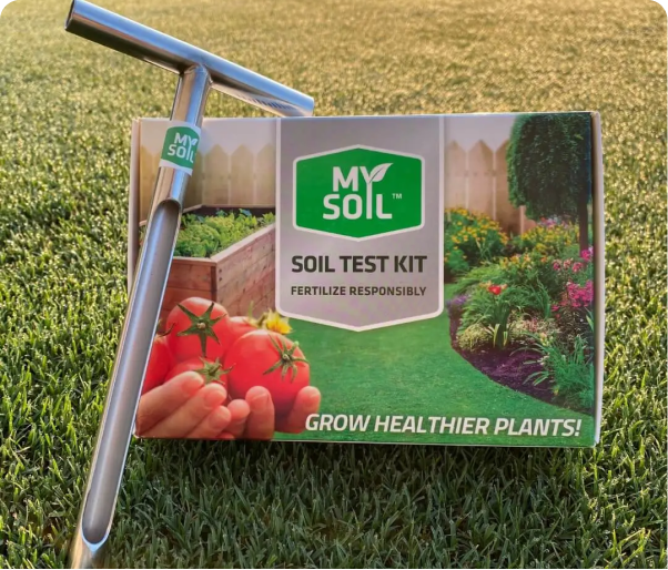 soil test kit and probe on lawn