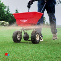 Earthway 2050 spreader on lawn