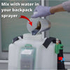 pouring liquid fertilizer into backpack sprayer